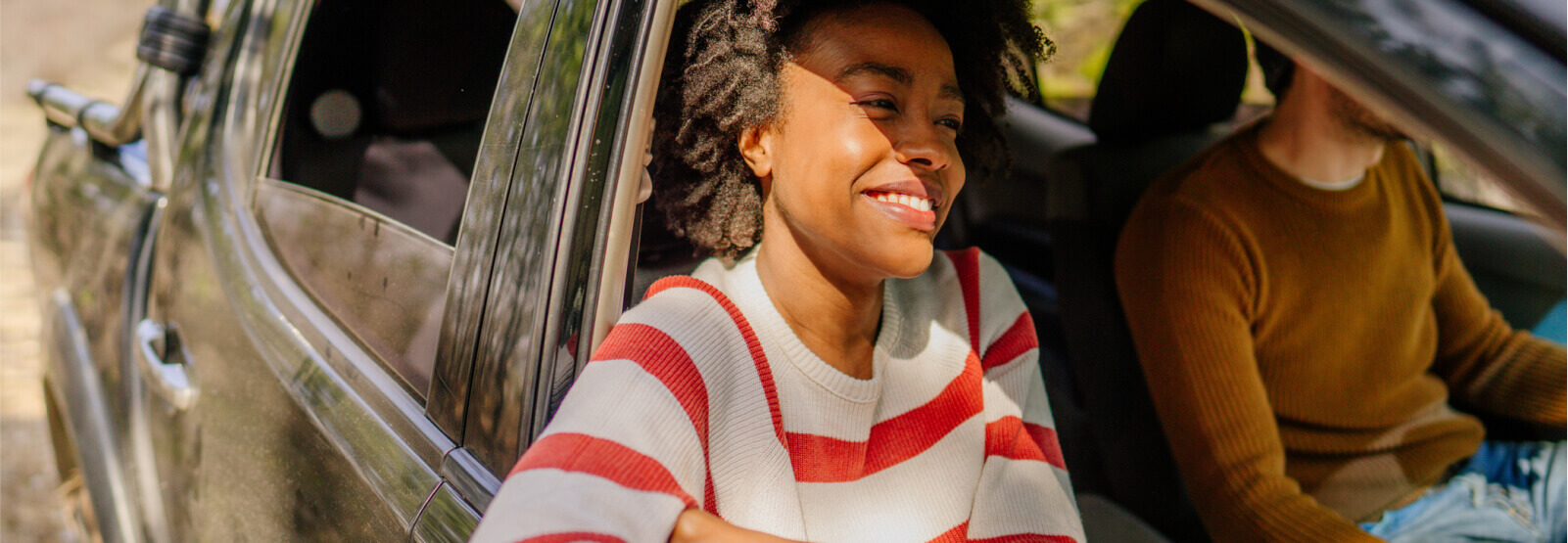 Woman in the passenger seat of a car